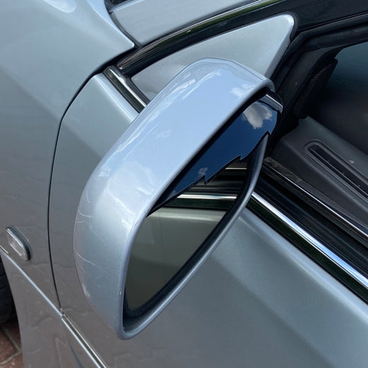 Wind deflectors for mirrors